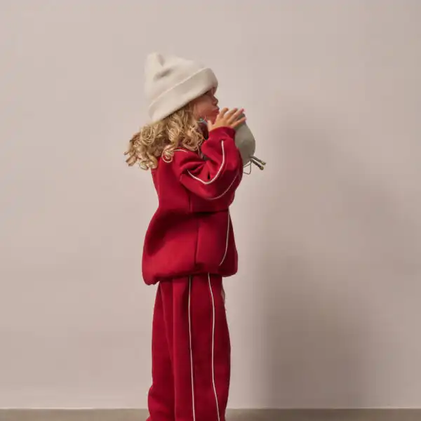 trenerka od dva dela u zelenoj boji gornji deo rolka sa rajsferslus i belim linijama sa strane kroz celu trenerku